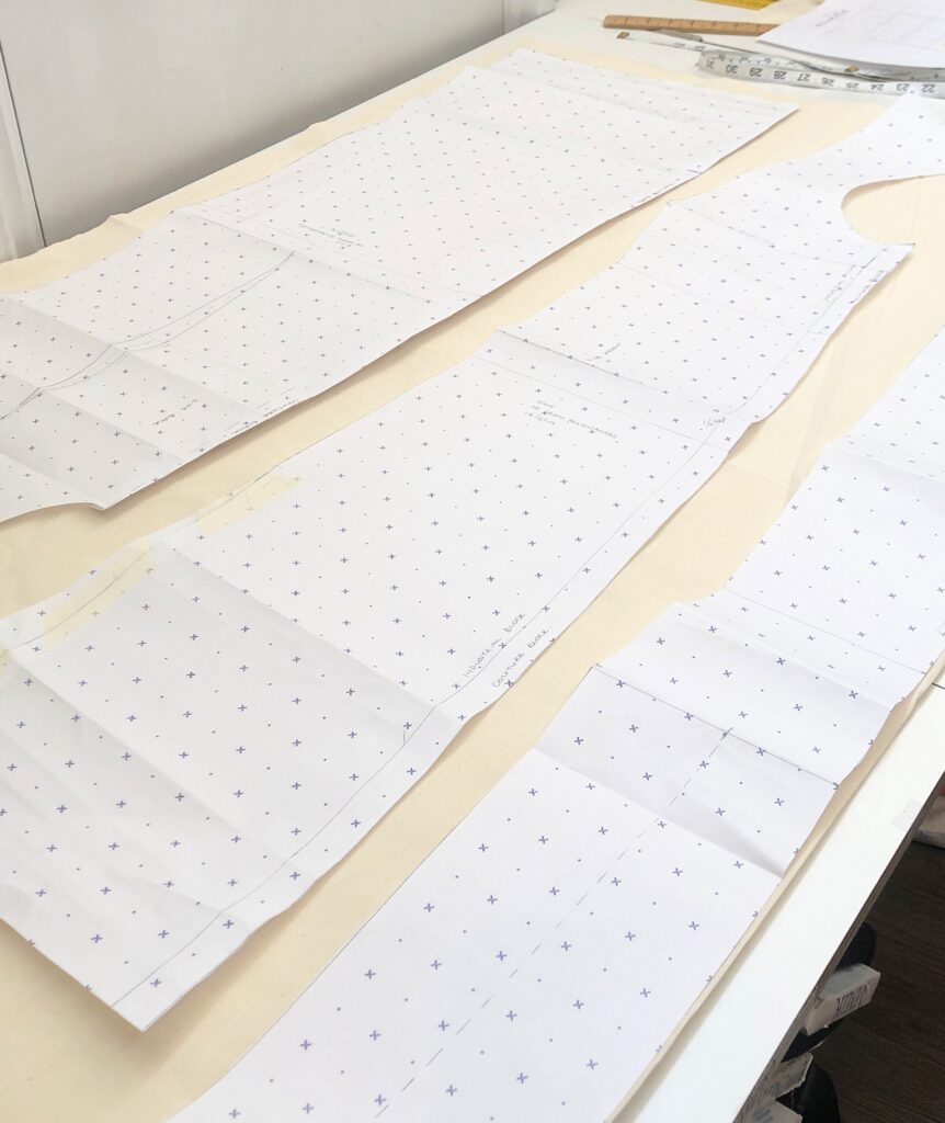 pattern laid on muslin fabric ready for cutting
pattern cutting
